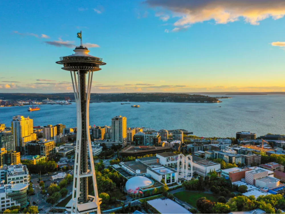 Aerial view of the Space Needle, one of the best places to visit in Washington State, overlooking the bay