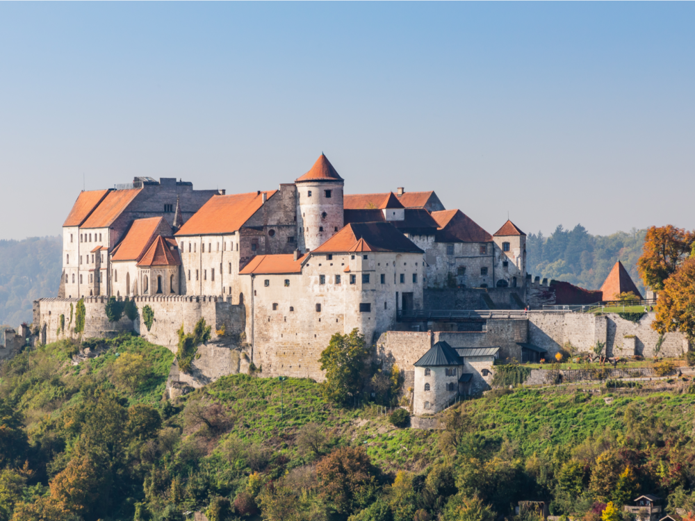The fortified Burghausen Castle with orange roofing, one of the best castles in Germany, built on top of a hill in Bavaria