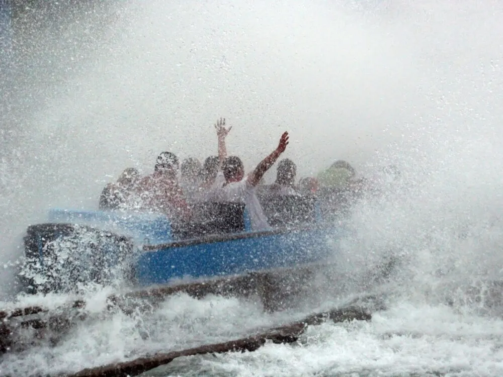 A group of friends having a fantastic time in one of the best things to do St. Louis, a water ride at Six Flags