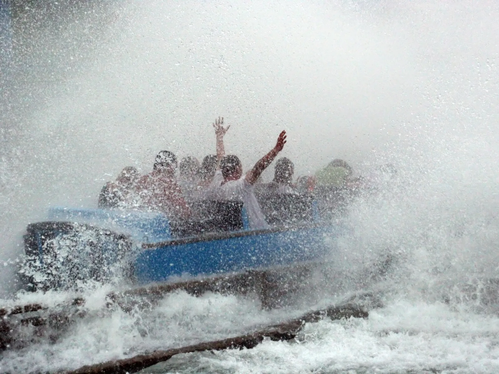A group of friends having a fantastic time in one of the best things to do St. Louis, a water ride at Six Flags