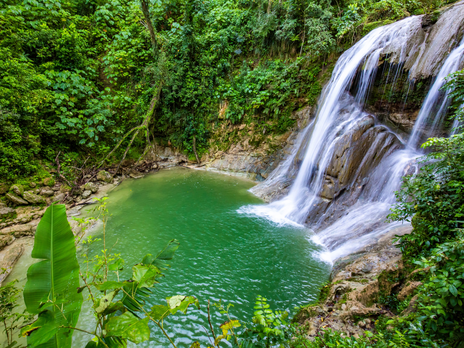 Gozalandia Waterfall pictured during the cheapest time to visit Puerto Rico