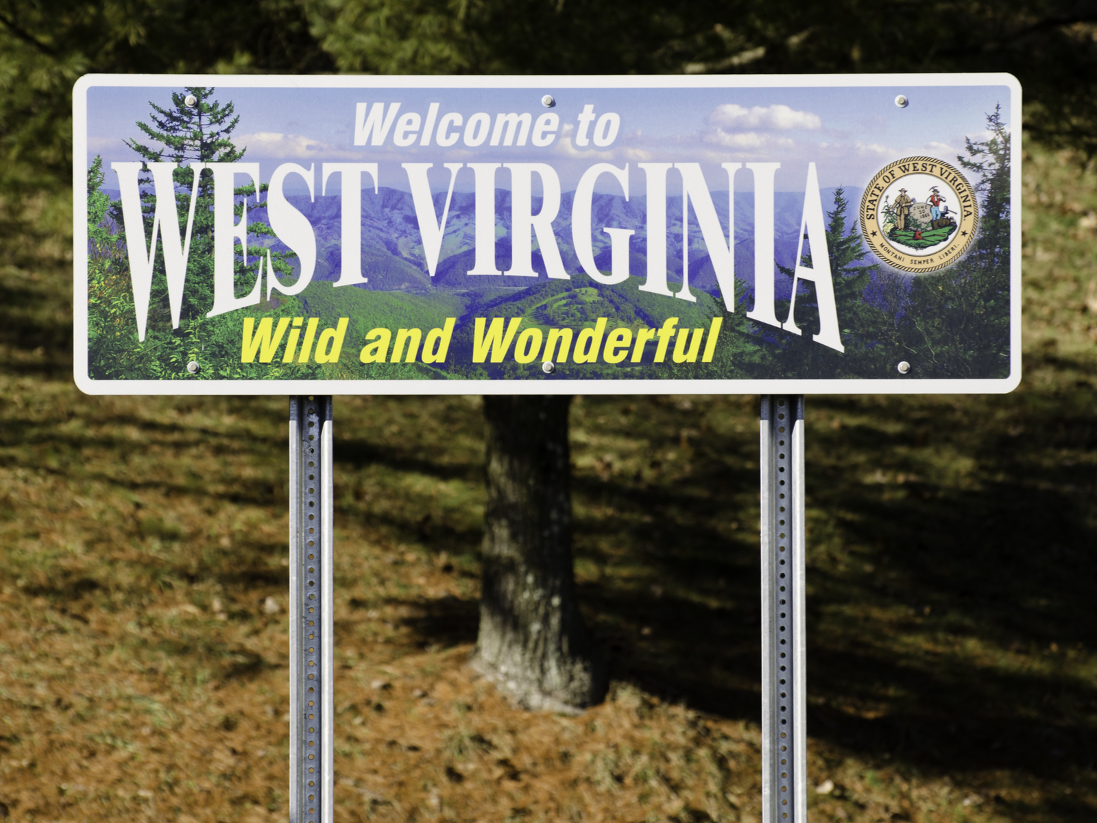 A welcome sign of West Virginia saying "Wild and Wonderful" hinting the best attractions in West Virginia