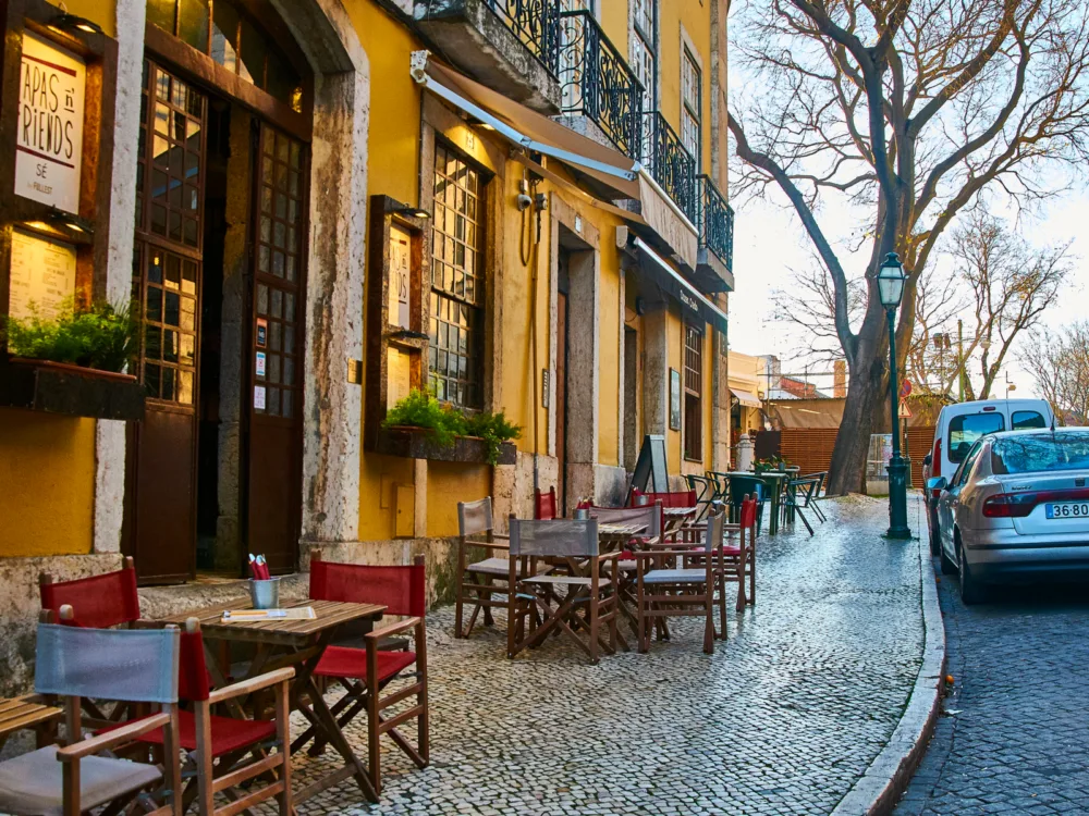 Cute cafe on the sidewalk of Lisbon, one of the best places to visit in Portugal