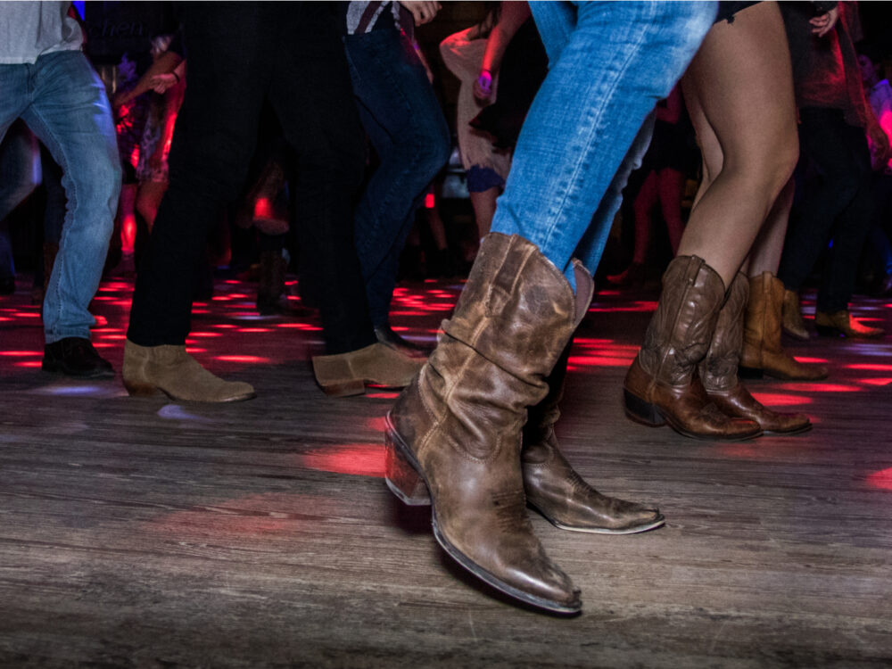 Line dancing in a honky tonk, one of the best things to do in Nashville