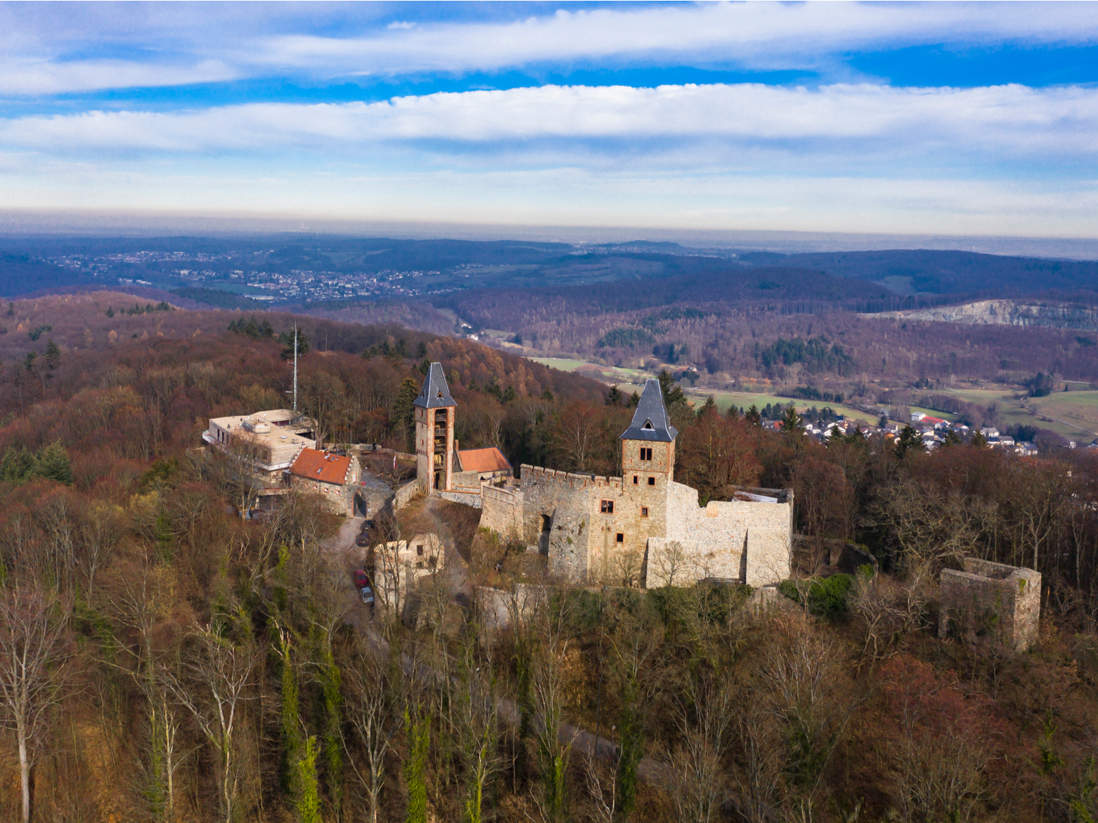 Aerial view on one of the landmarks and the best castles in Germany, Frankenstein Castle distant from a town in Darmstadt