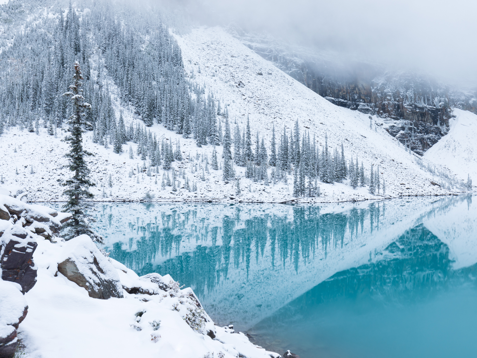 Lake Moraine pictured during the worst time to visit Banff with lots of snow and closures