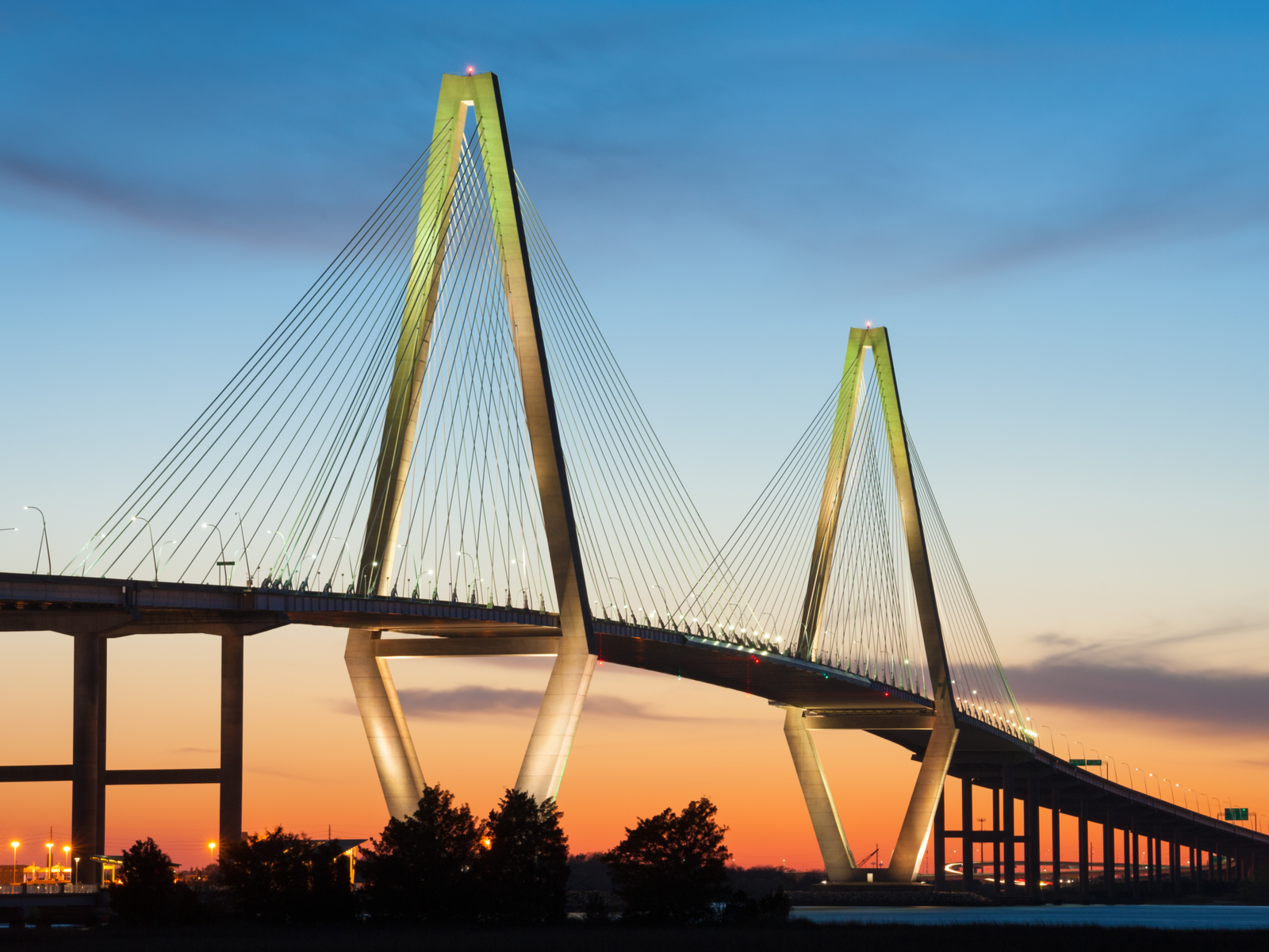 Crimson sunset over the iconic Cooper River Arthur Ravenel Jr. Bridge, a pick on the best South Carolina attractions
