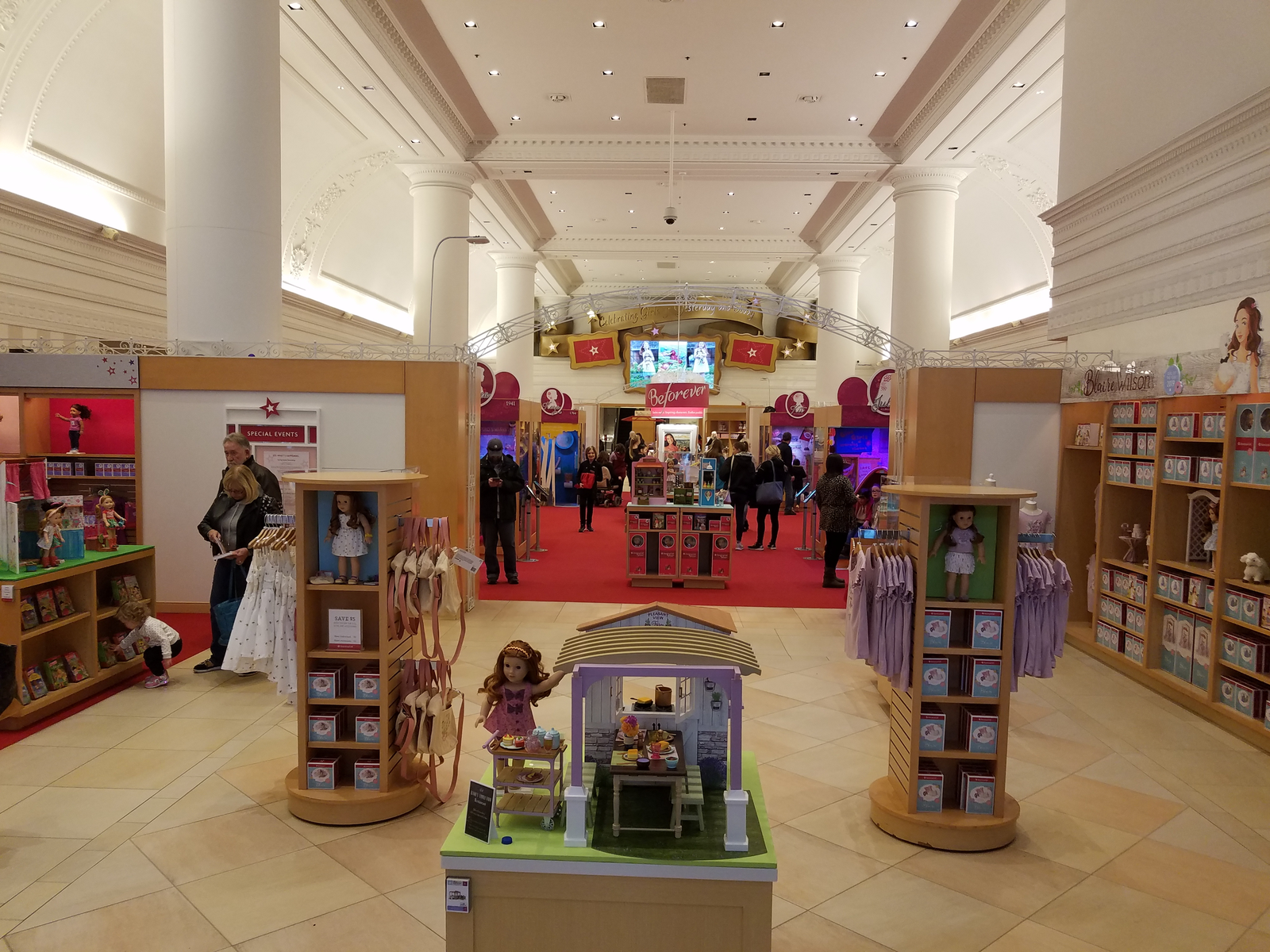 Parents with their daughters shopping some dolls and dollhouses in American Girl Place, in Chicago, one of the best toy stores in America