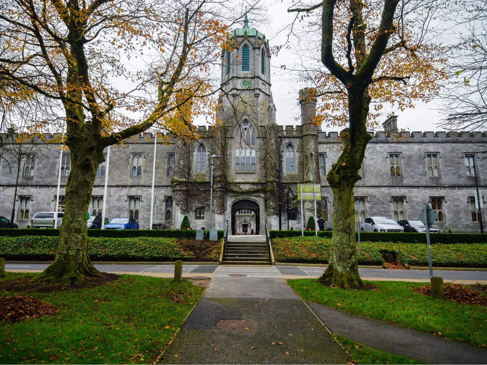 Fall on National University of Ireland in Galway, one of the best universities in Ireland, where cars are parked at the entrance with vines attached on its walls