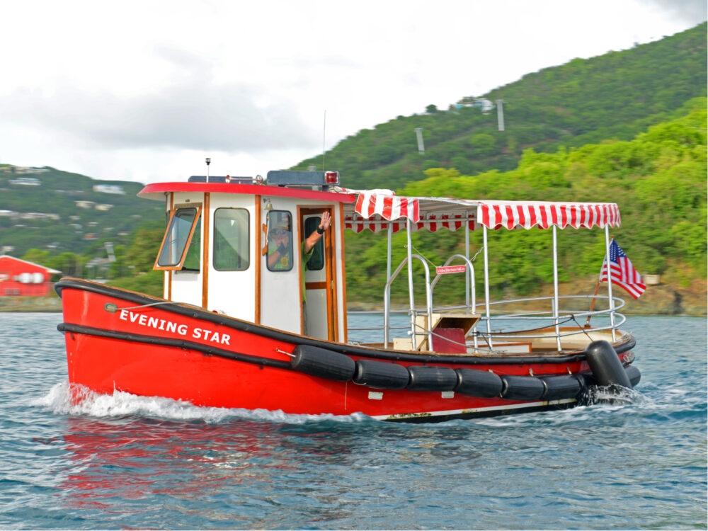 Image of a water taxi painted red that you'll take to one of the best resorts in St. Thomas