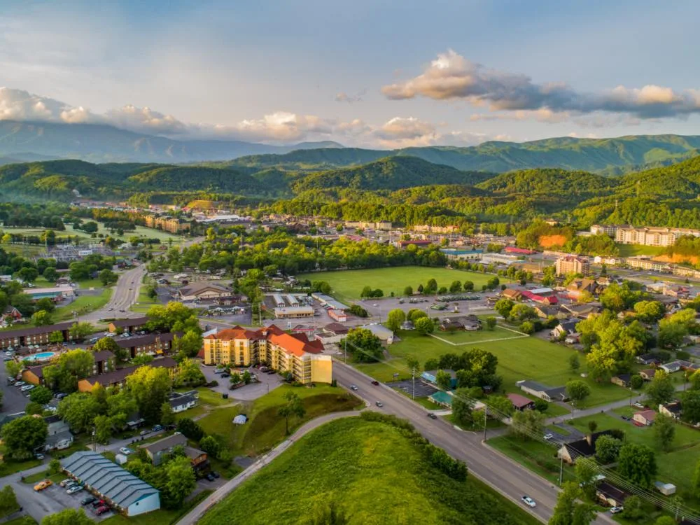 Overhead view on Pigeon Forge and Sevierville Tennessee, one of the best places to visit in Tennessee, with its green landscape and mountain skyline