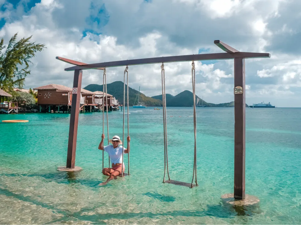 Girl on a swing in Saint Lucia during the best time to visit the island