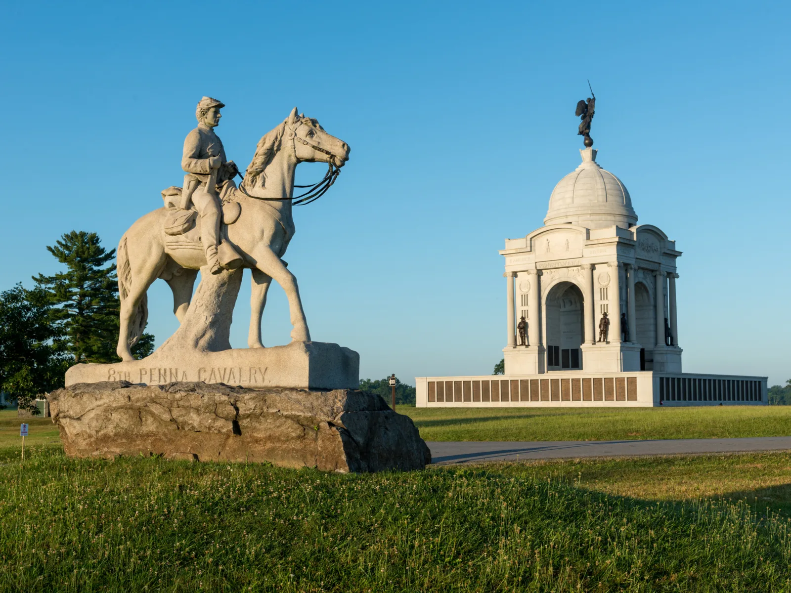The historic Cavalry Statue standing in front of the Pennsylvania State Monument pictured during a clear day as a piece on the best things to do in Pennsylvania