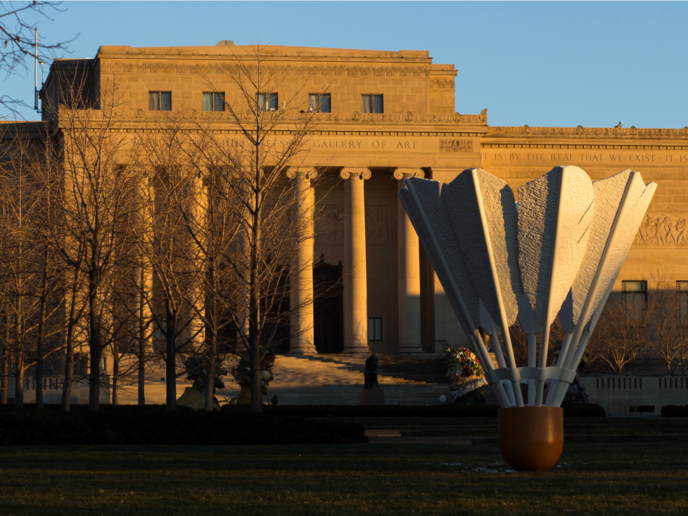 A sweet autumn sunrise on tall six columns of Nelson-Atkins Museum of Art, one of the best things to see in Kansas, and a giant shuttlecock sculpture in front