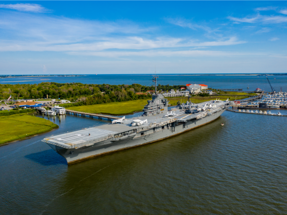 Aerial view on the humongous USS Yorktown anchored at Mount Pleasant, a pick on the best South Carolina attractions, carrying military choppers and aircrafts