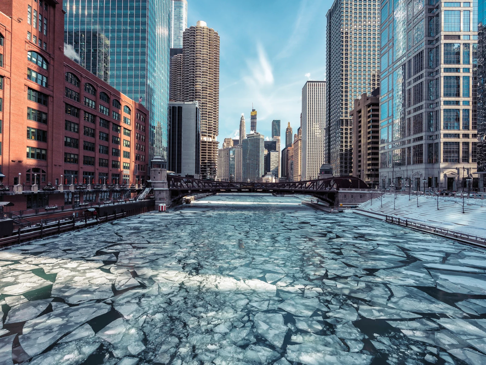 Ice on the Chicago river pictured during February, the cheapest time to visit