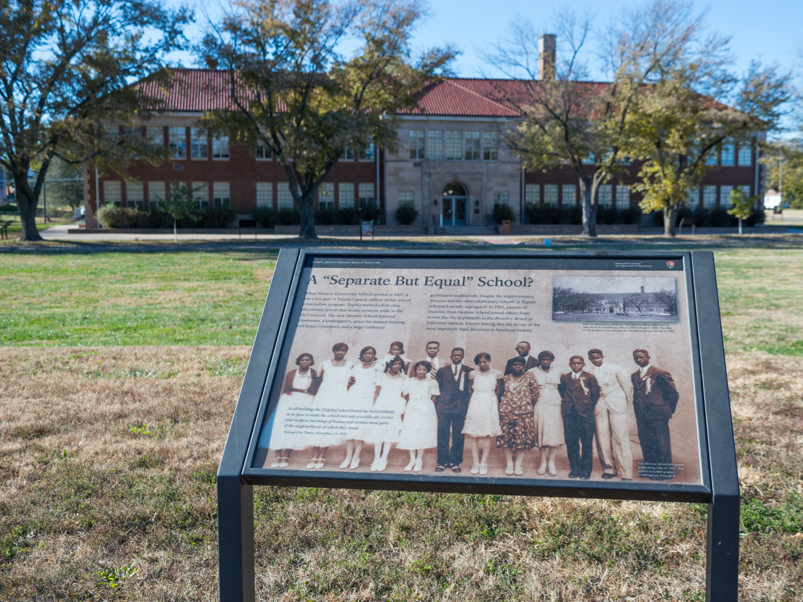 An old photograph of colored people exhibited in front of the main entrance, Brown v. Board of Education National Historic Site, on one of the best things to see in Kansas