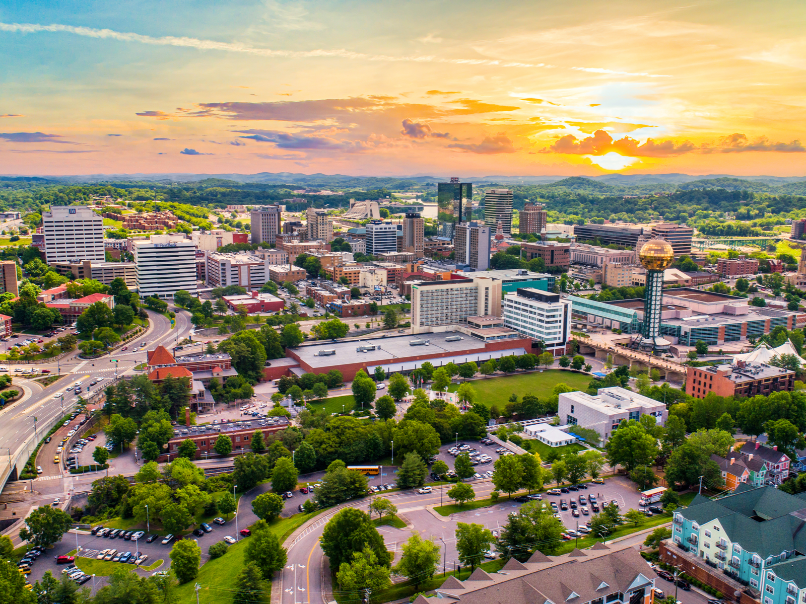 Aerial view on one of the best places to visit in Tennessee, Knoxville's downtown skyline during a golden sunset