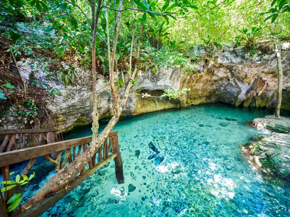 Cave with turquoise water, one of the things to do in Cancun, pictured from the entrance