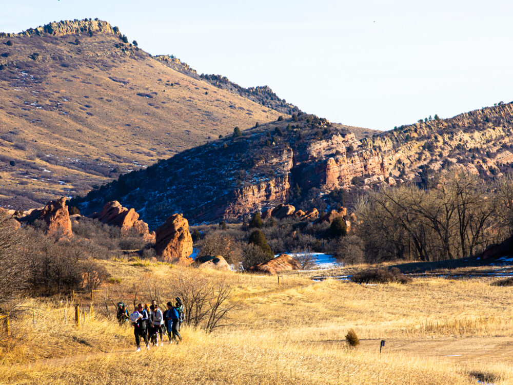 Hikers taking on the Coyote Song Trail, one of the best hikes near Denver, on a hot afternoon