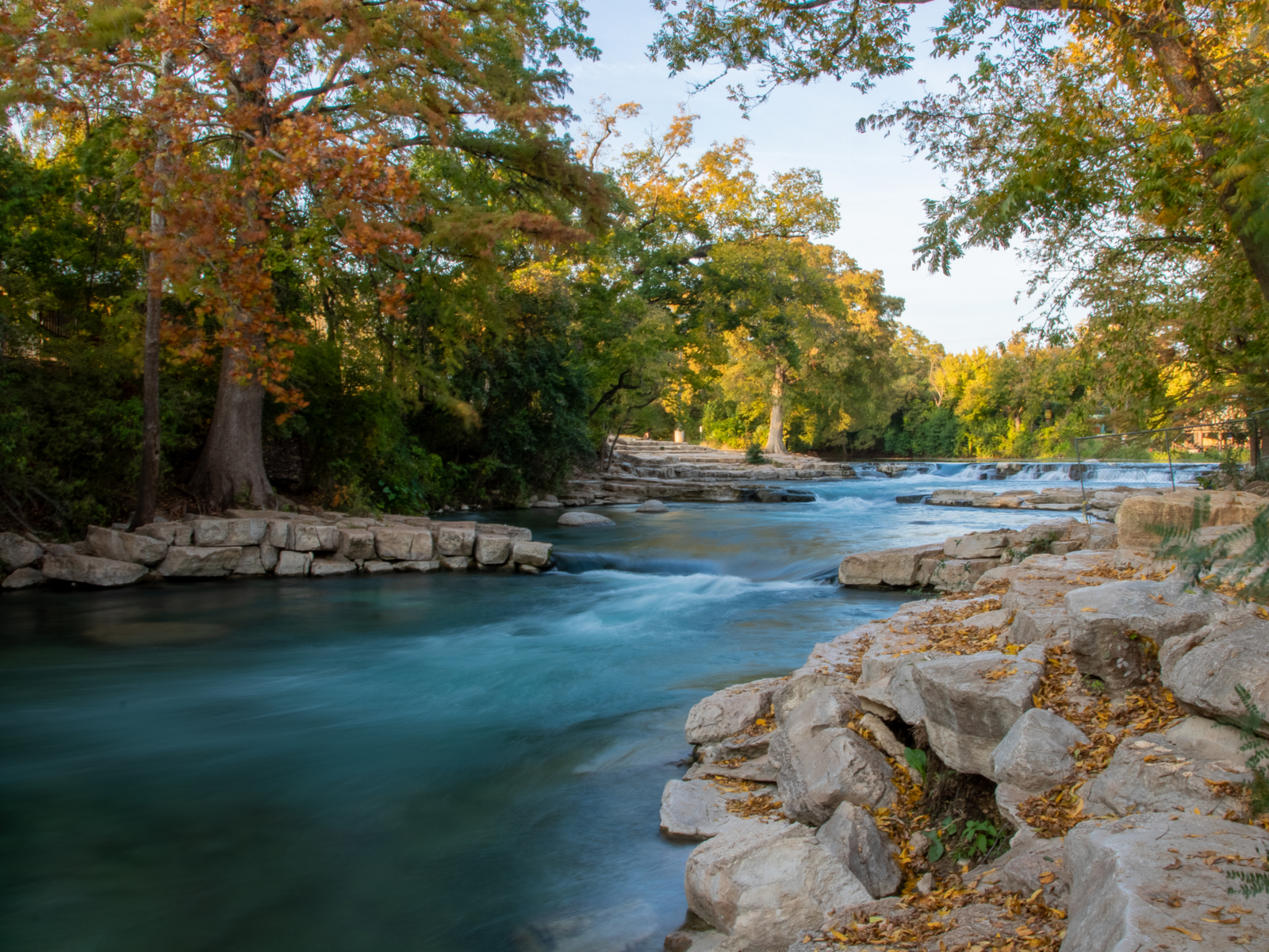 Autumn day by the San Marcos River, one of the best things to do in Texas, as pictured from the shore