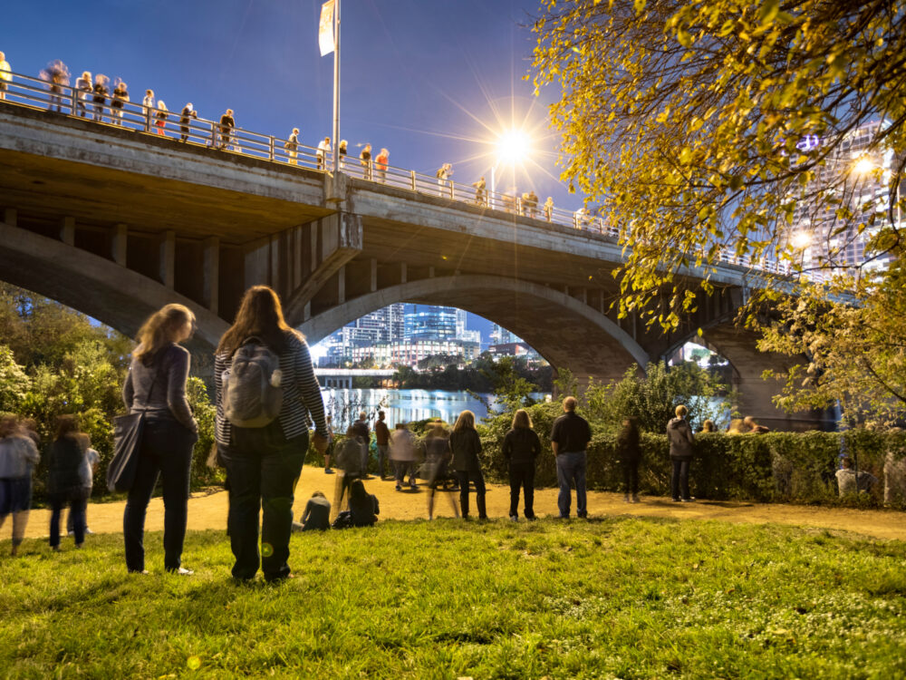People in Austin waiting for the Congress Bridge Bats, one of the best things to do in Texas