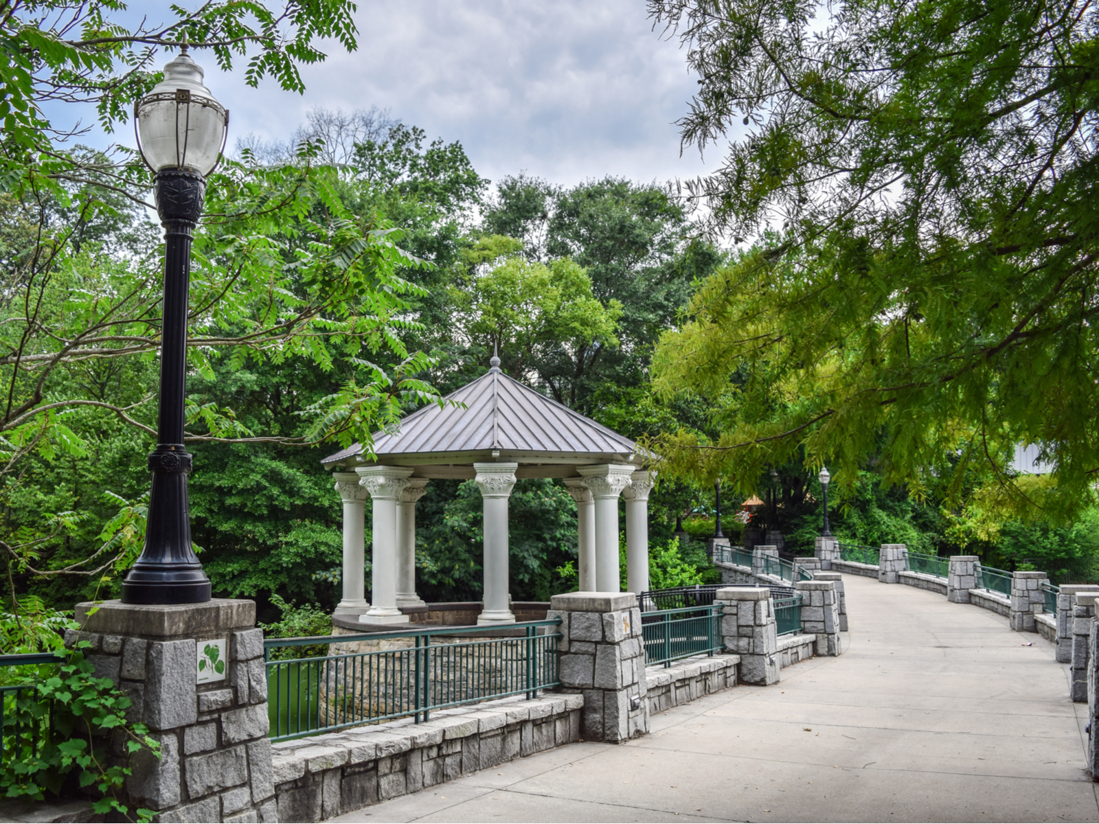 Beautiful view of a walkway in one of the best attractions in Atlanta, Piedmont Park, in the summer