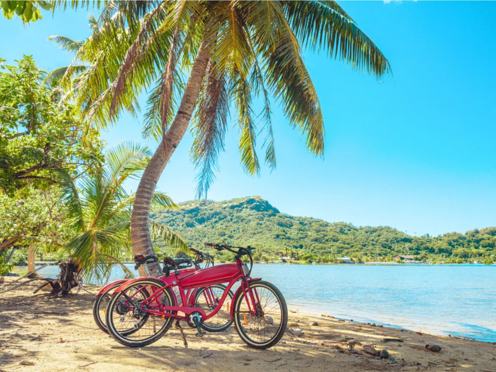 Ebikes pictured by the shore during the best time to go to Bora Bora