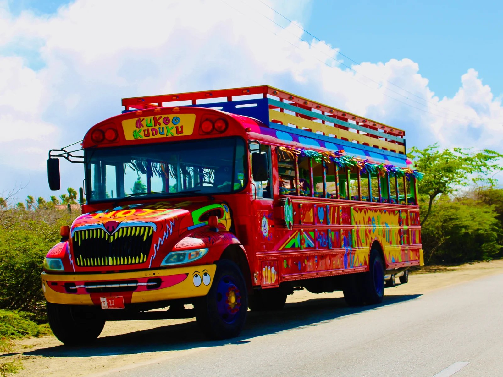 Exterior shot of the Kukoo Kunuku Party Bus, one of Aruba's best things to do