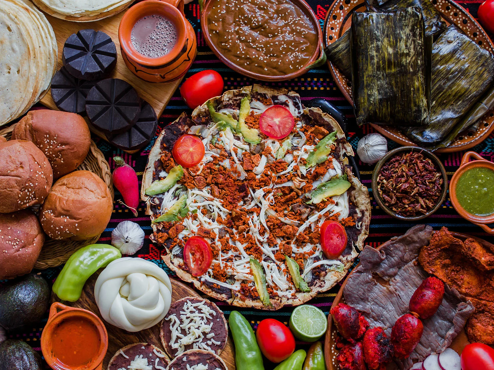 Traditional Oaxaca dishes served on a table at Casa Oaxaca, one of the best restaurants in Cancun