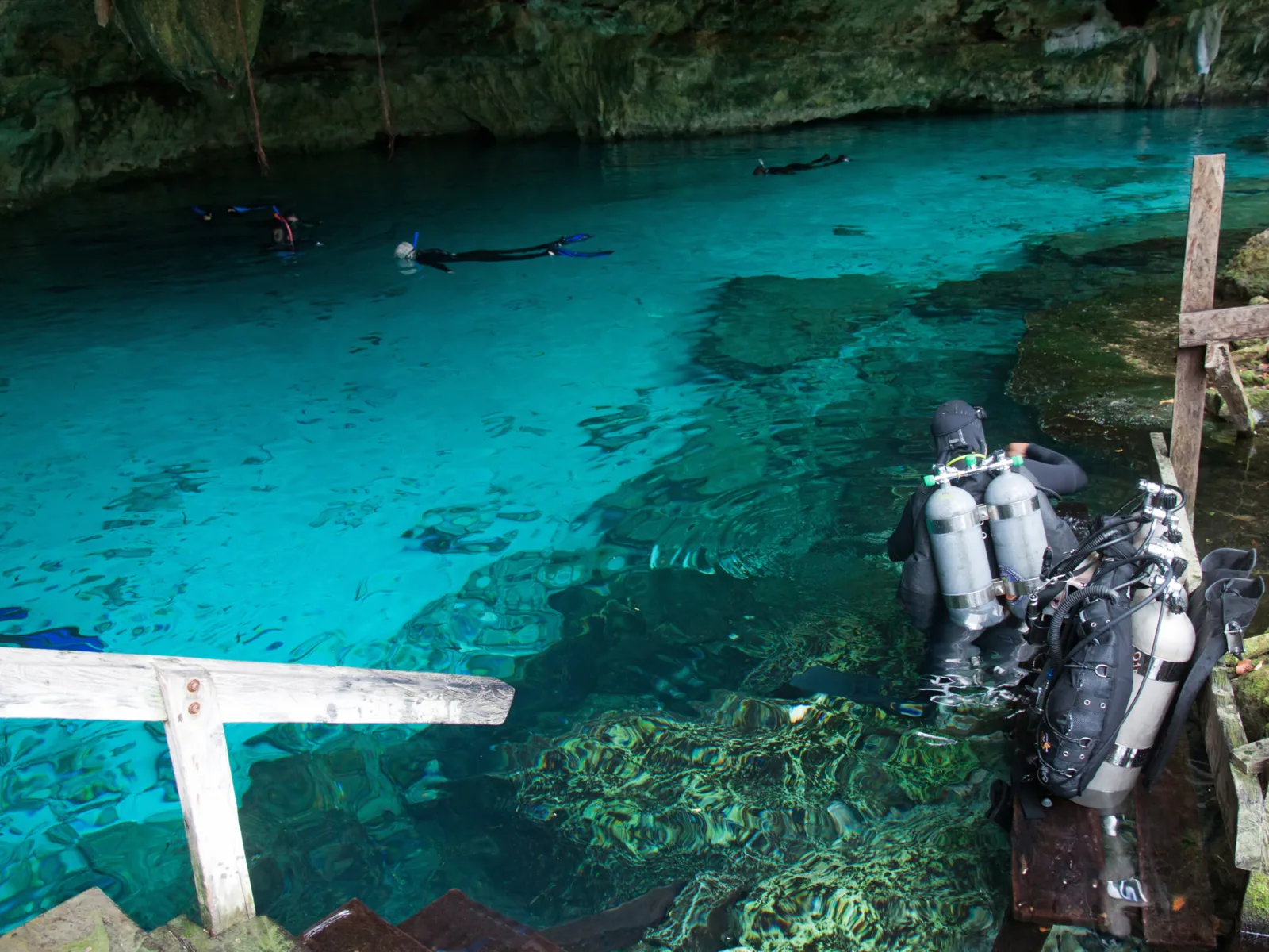 Cenote Angelita, one of the best cenotes in Mexico, with divers and snorkelers in the water