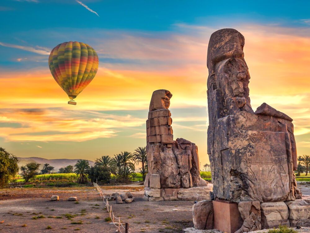 Hot air balloon pictured over the Luxor at sunrise during the best time to visit Egypt