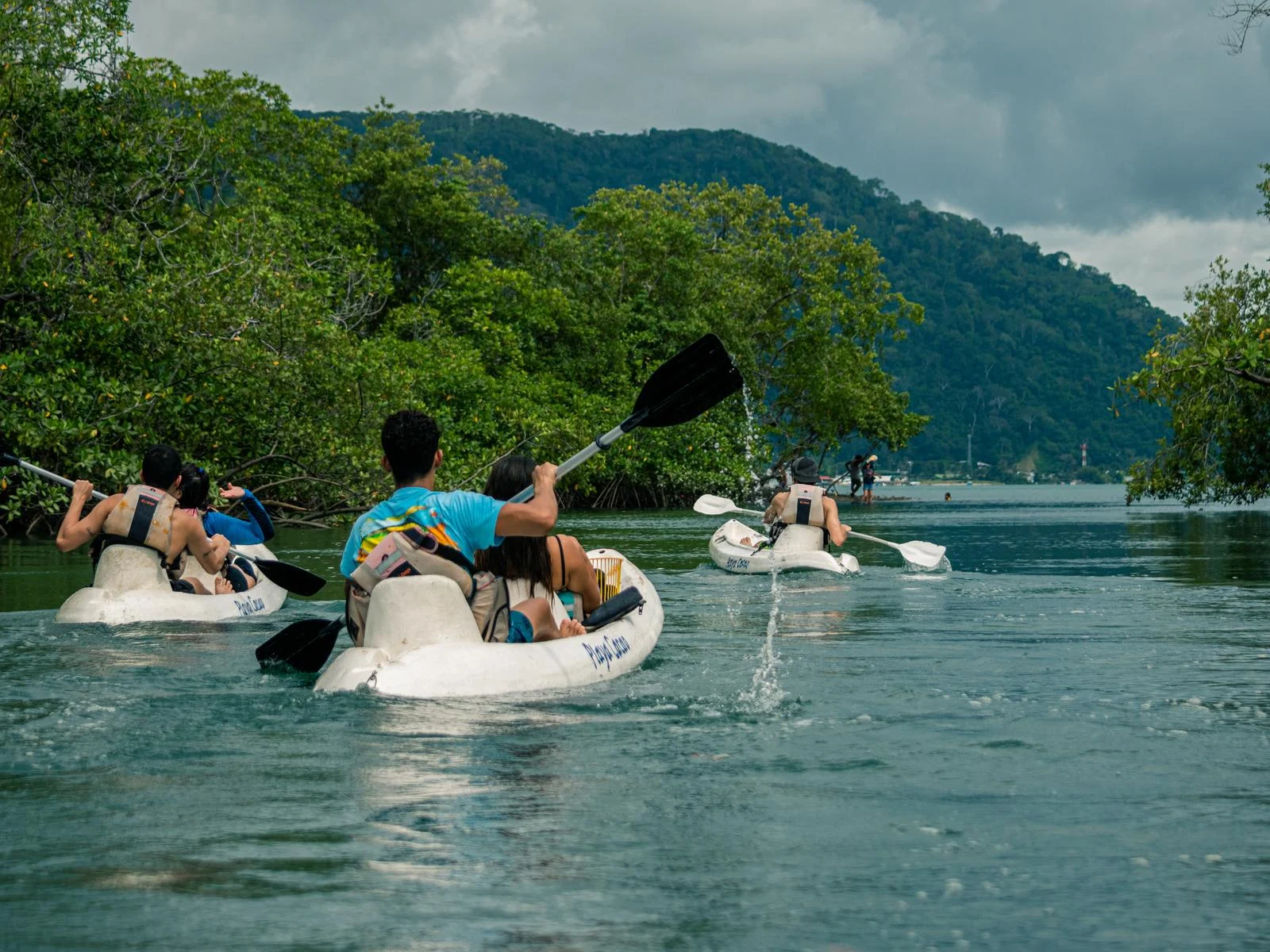 Couples Kayaking at the green waters of the Mangroove of Golfito, one of the best things to do in Costa Rica