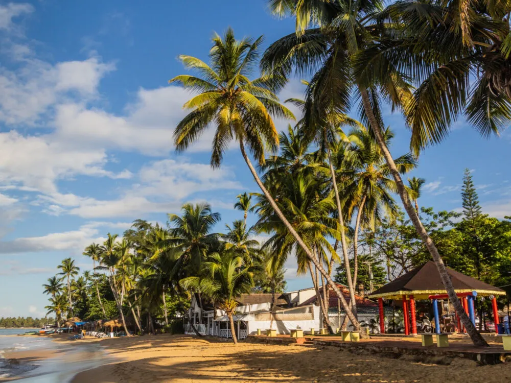 Las Terrenas, one of the best places to go in the Dominican, with a beach and a few small homes on the ocean