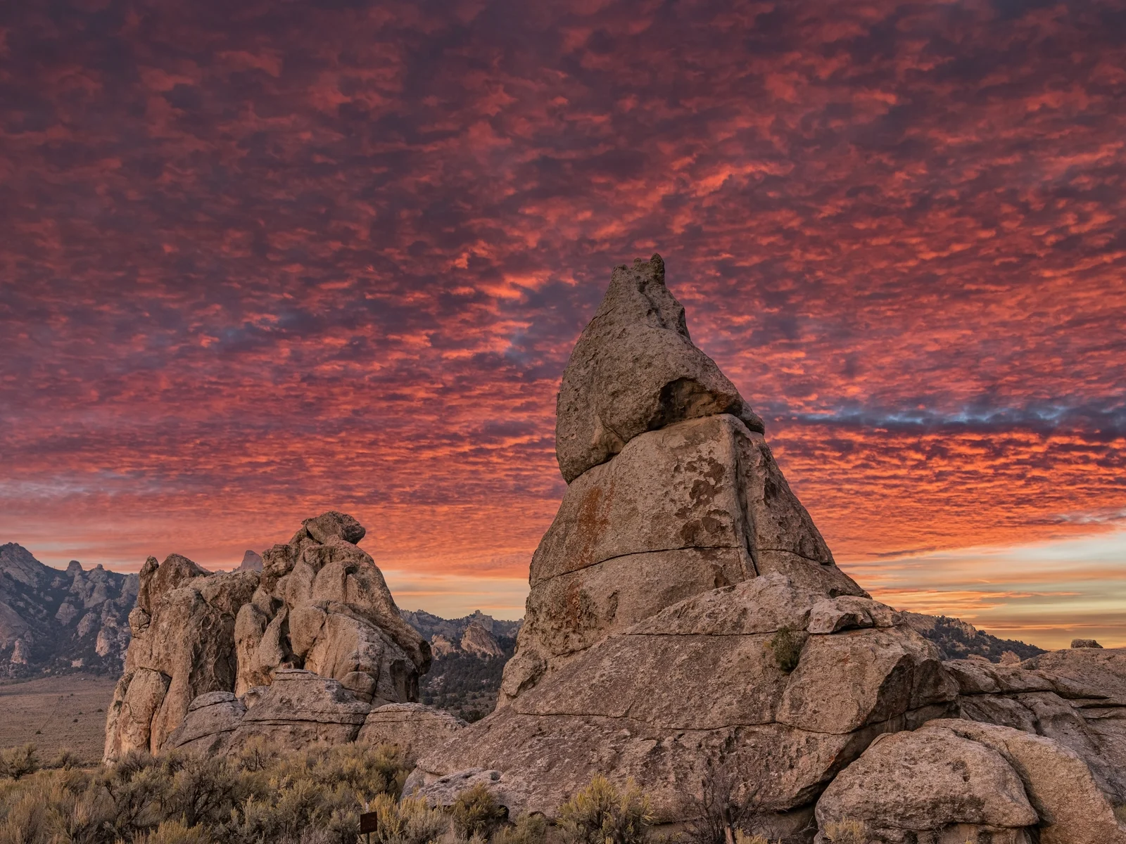 One of the best things to see in Idaho, crimson sunset setting the huge rock formation in City Of Rocks National Reserve