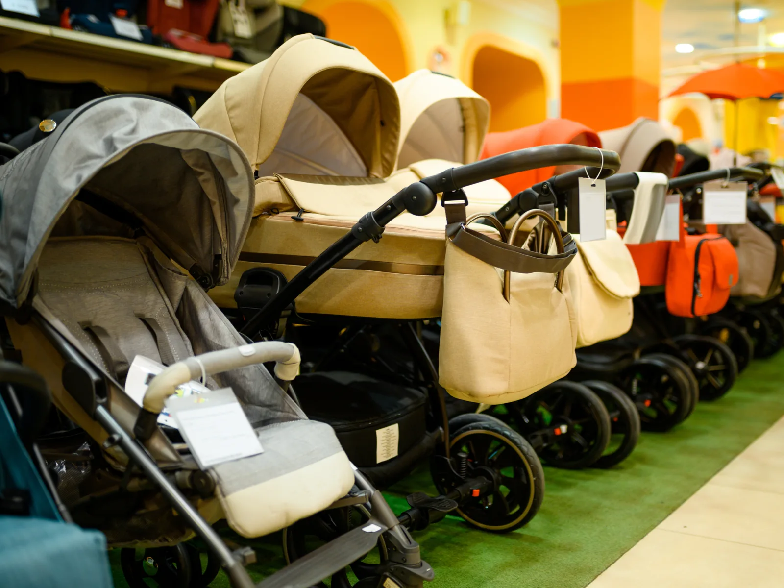 Row of the best travel strollers in a store