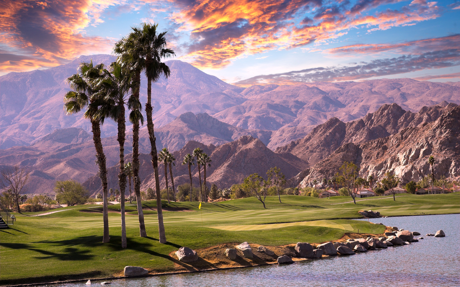 Gorgeous view of a sunset over one of the best hotels in Palm Springs and a golf course