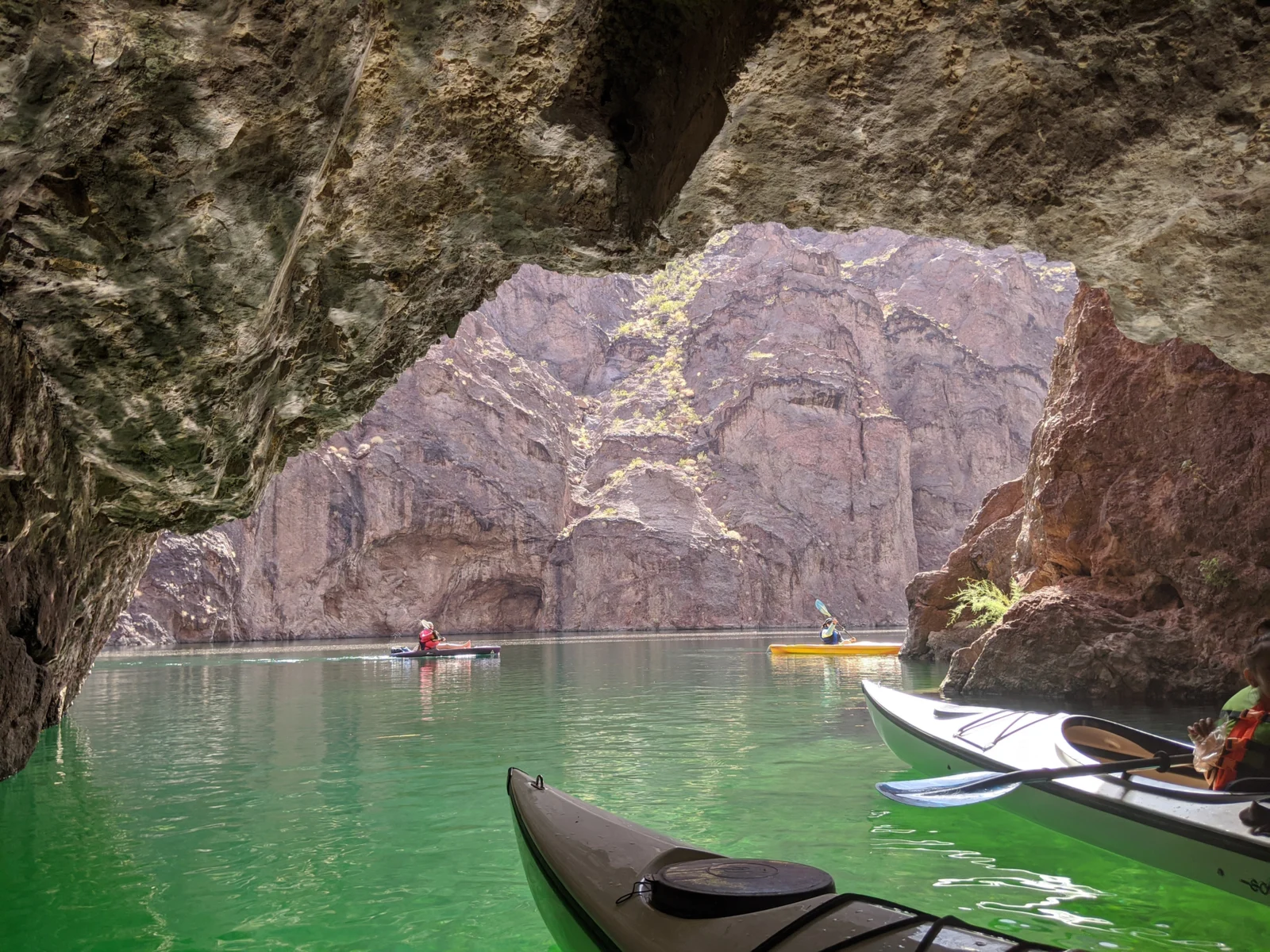 Emerald Cove, one of the best things to do in Las Vegas, as viewed from a kayak under a rock formation