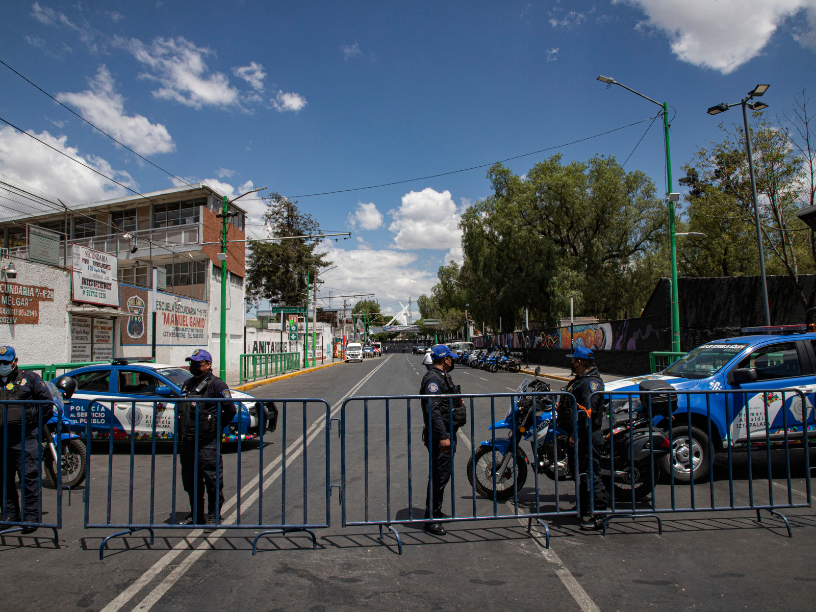 Iztapalapa with police outside the gates for a piece on Is Mexico City Safe