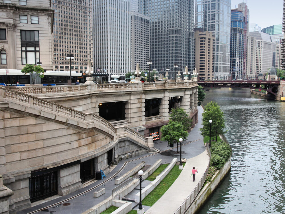Cement riverwalk, one of the best things to do in Chicago, pictured during the middle of the day