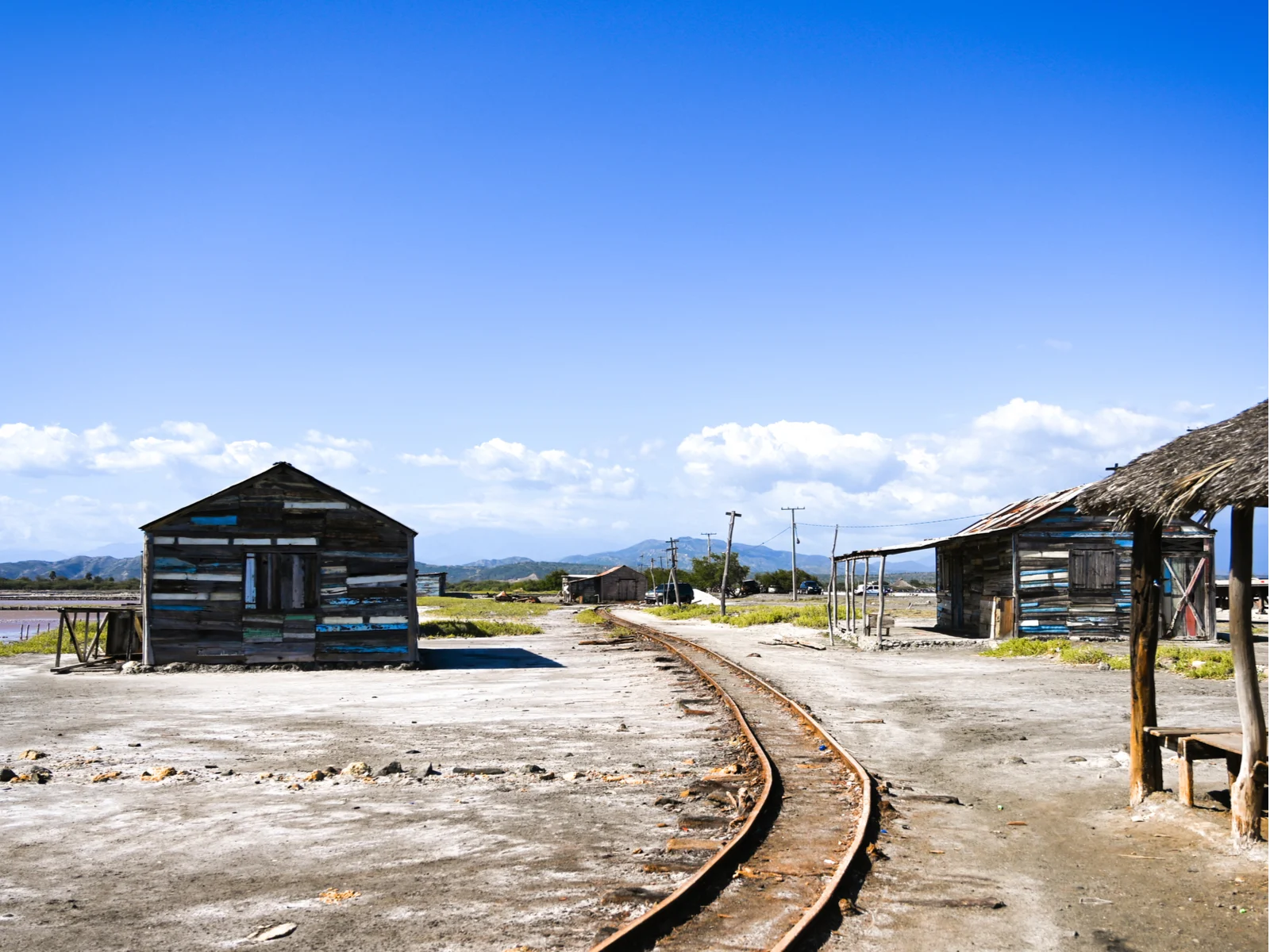 An amazing view of railroad tracks in the salt mines in Salinas, one of the best things to do in the Dominican Republic