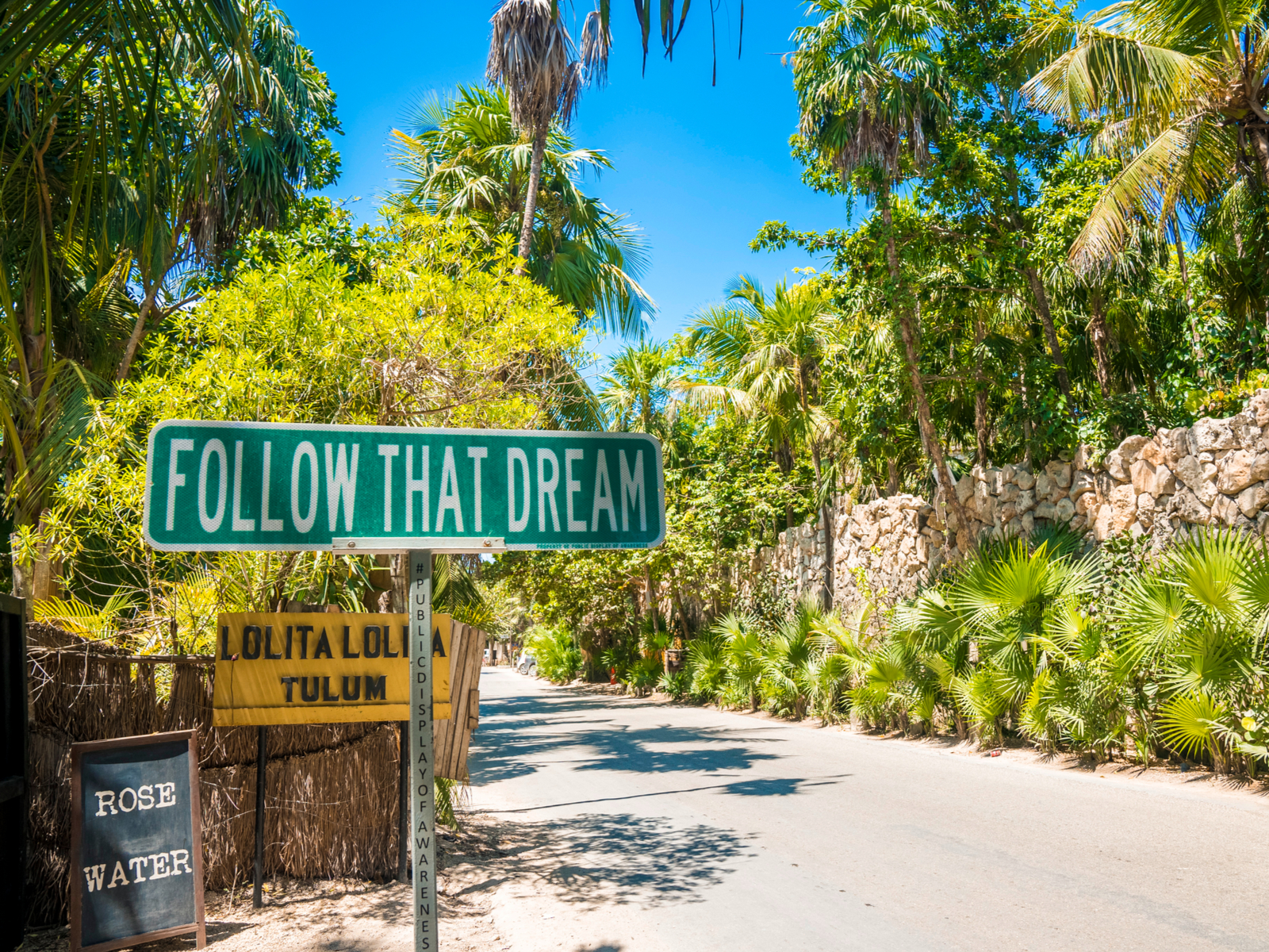 Sign that says Follow That Dream for a piece on the best hotels in Tulum