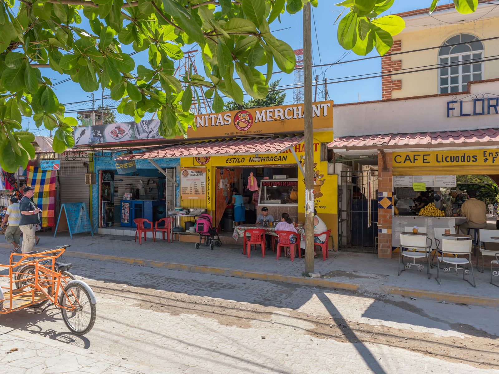 Pueblo Tulum pictured with an old bicycle and some shops for a piece on Where to Stay in Tulum