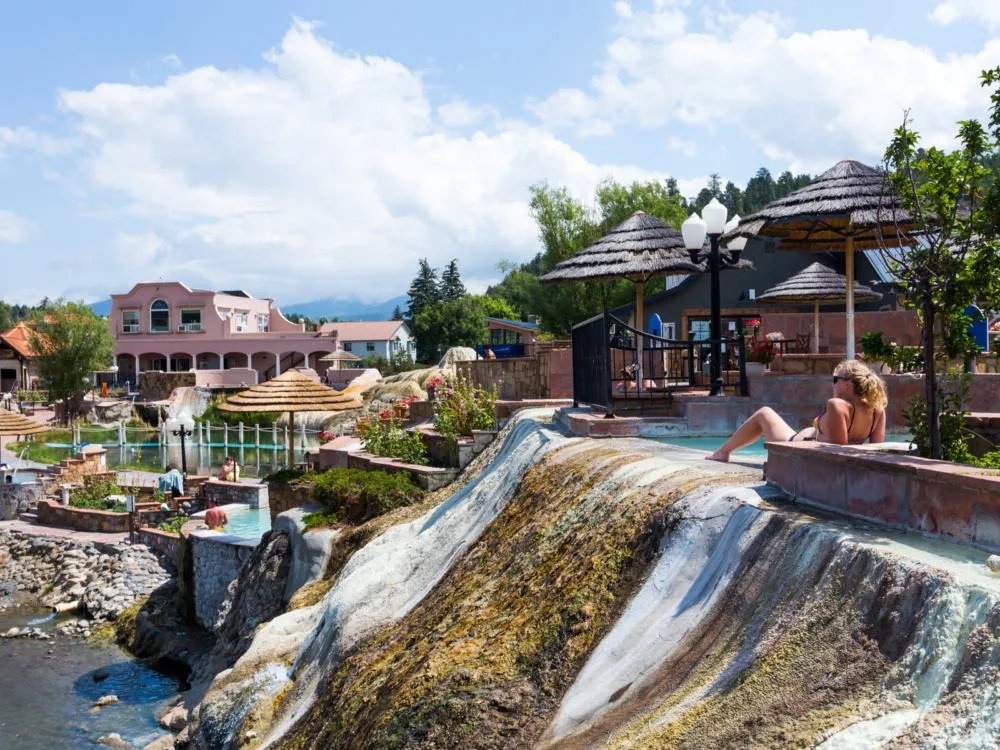 Woman relaxing at the Pagosa Hot Springs, one of the best hot springs in Colorado