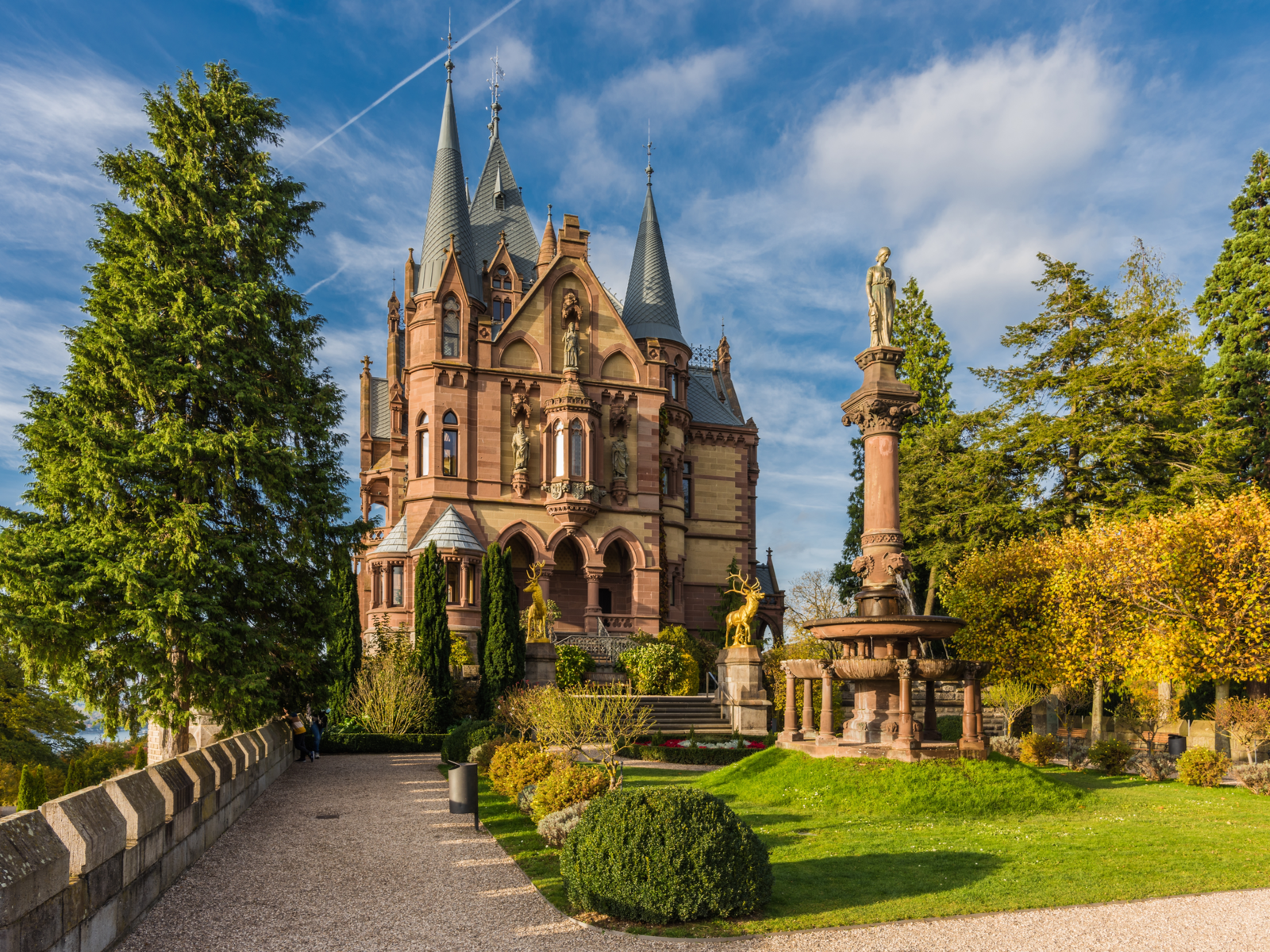The grand Drachenburg Castle in Königswinter, considered as one of the best castles in Germany, stationed two golden deer statue at the entrance and a woman statue atop a fountain