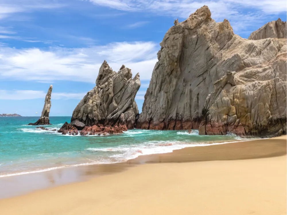 Cabo pictured during the least busy time to visit with an empty beach next to the arch