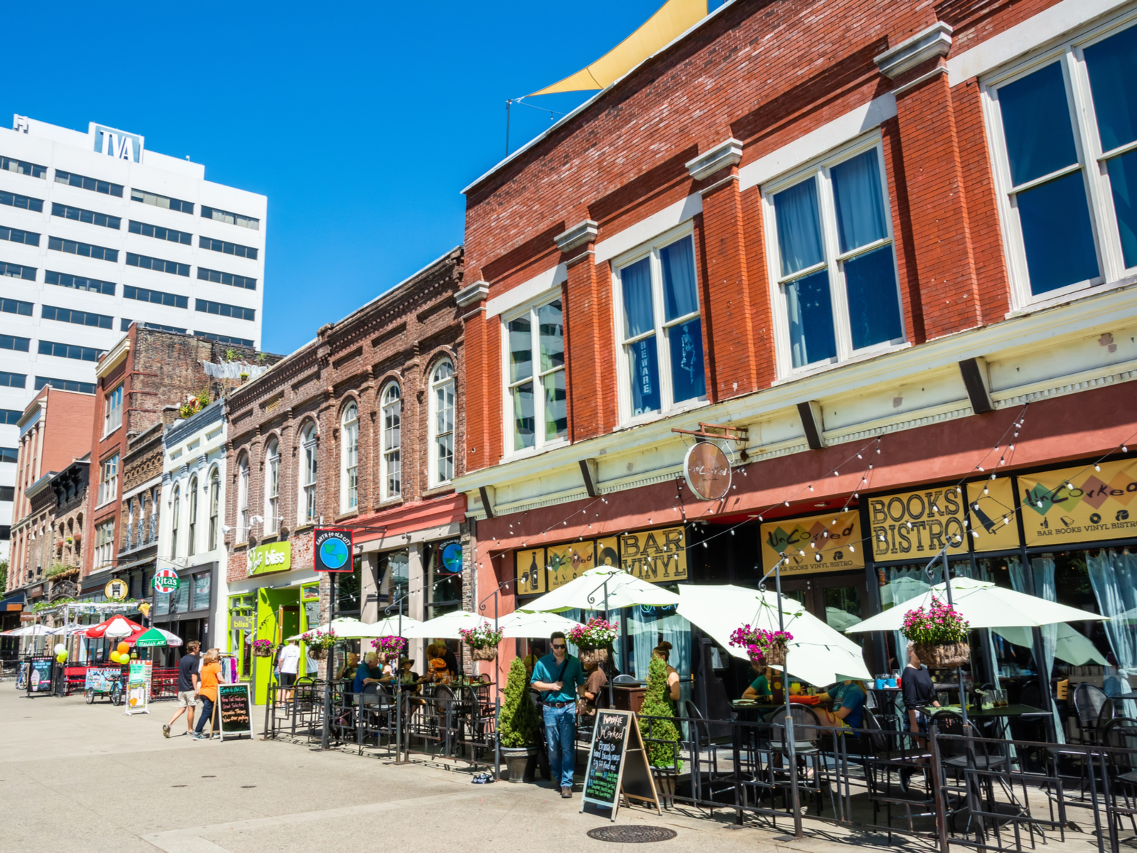 People enjoying lunch during a clear day at a series of restaurants in historic buildings and commercial properties on the Market Square, one of the best things to do in Tennessee
