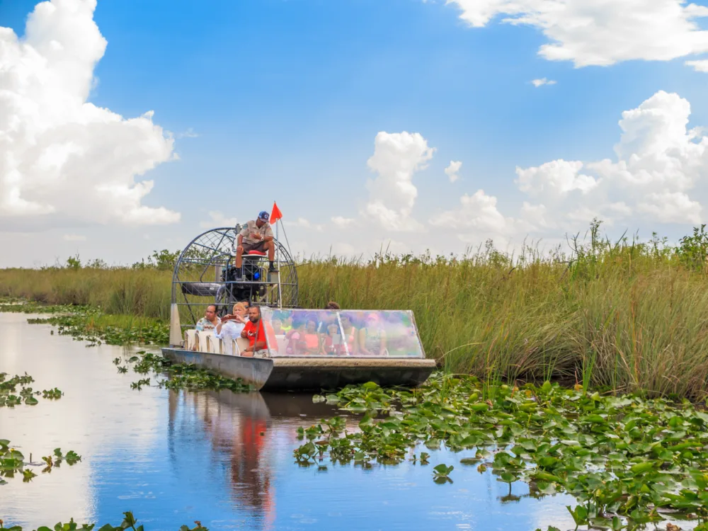 Guy giving airboat rides in Everglades National Park, a must-do activity in South Florida