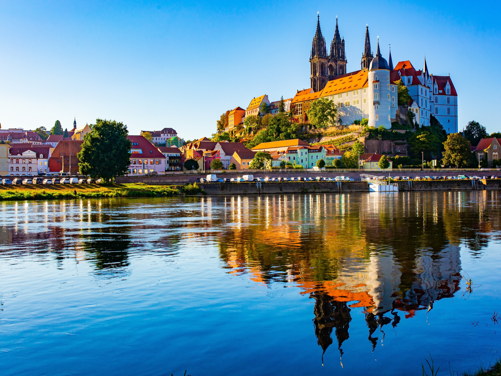The Albrechtsburg Castle, titled as one of the best castles in Germany, and the town structures at Meissen reflected on the calm Elbe River