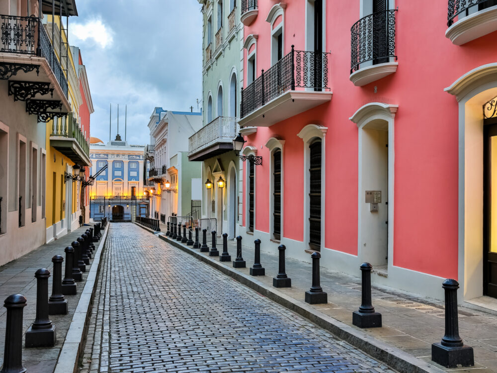 Street in Old San Juan pictured with bright colored buildings for a piece titled Is Puerto Rico Safe to Visit
